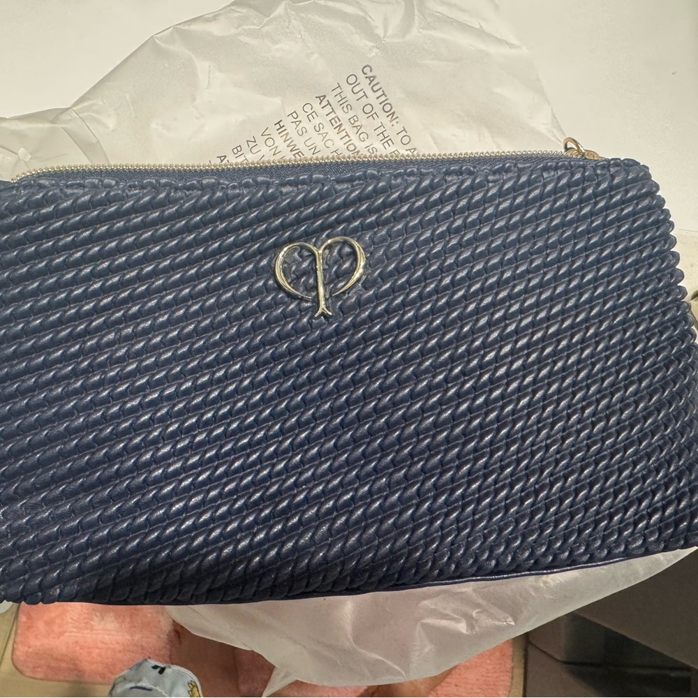New Cle de peau navy blue makeup bag that can be used as a small clutch, gold